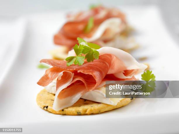 prosciutto and brie crackers - white cheese stock pictures, royalty-free photos & images