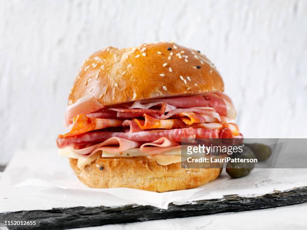 italian deli sandwich on a brioche bun - prosciutto stock pictures, royalty-free photos & images