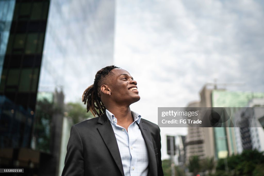 Businessman contemplating the sky