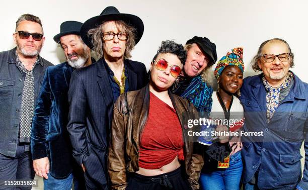 Mike Scott and The Waterboys pose backstage following an instore session to celebrate the launch of their new album 'Where The Action Is' at HMV...