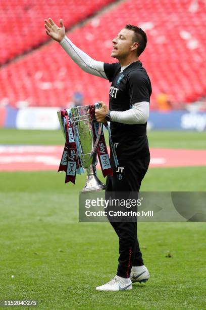 John Terry, Assistant Head Coach of Aston Villa celebrates with the trophy following the Sky Bet Championship Play-off Final match between Aston...