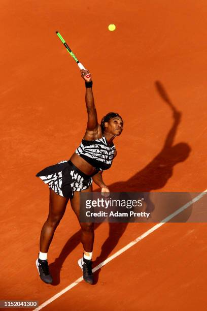 Serena Williams of The United States serves during her ladies singles first round match against Vitalia Diatchenko of Russia during Day two of the...