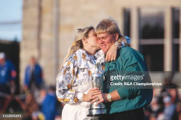 John Daly of the United States gets a kiss from his wife Paulette following his victory during The 124th Open Championship held on the Old Course at...