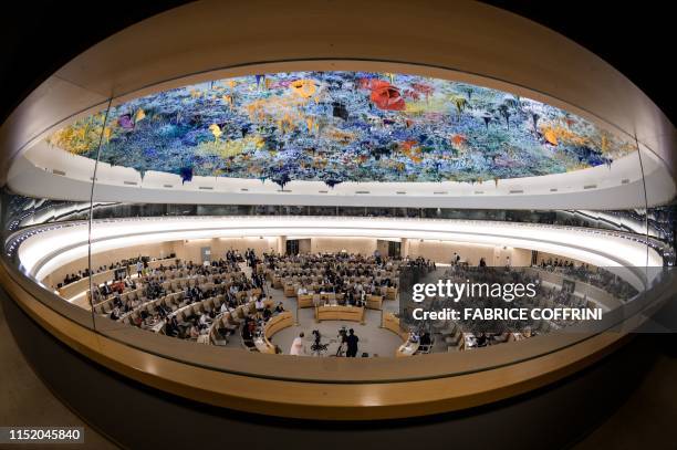 Picture taken on June 26, 2019 shows a general view of the United Nations Human Rights Council room during a debate on the report of special...