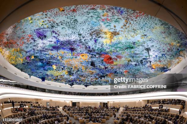 Picture taken on June 26, 2019 shows a general view of the United Nations Human Rights Council room during a debate on the report of special...