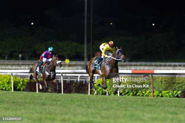 Jockey Zac Purton riding Hong Kong runner Southern Legend wins Race 9 Kranji Mile at Kranji Racecourse on May 25, 2019 in Singapore. Jockey Karis...
