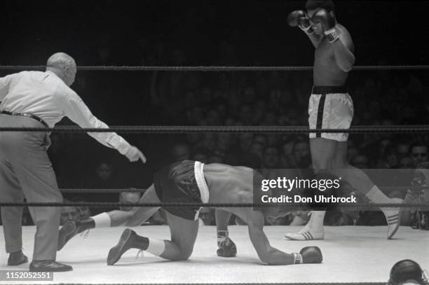 World Heavyweight Title: Muhammad Ali victorious after nockdown vs Cleveland Williams getting up from canvas at Astrodome. View of SI photographer...