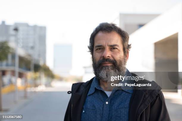 middle aged man in a city street - beard men street stock pictures, royalty-free photos & images