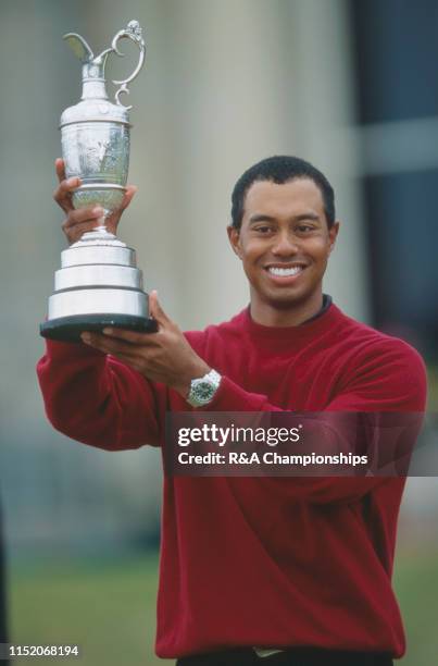 Tiger Woods of the United States holds the Claret Jug following his victory during The 129th Open Championship held on the Old Course at St Andrews,...