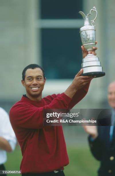 Tiger Woods of the United States holds the Claret Jug following his victory during The 129th Open Championship held on the Old Course at St Andrews,...