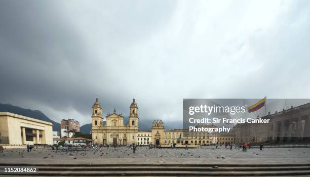 bogota cathedral, capilla del sagrario and capitolio nacional on bolivar square (plaza bolivar) in bogota, colombia - kapitoleum bildbanksfoton och bilder