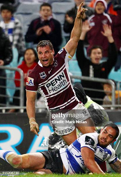 Anthony Watmough of the Eagles celebrates his try during the round 13 NRL match between the Caterbury Bulldogs and the Manly Warringah Sea Eagles at...