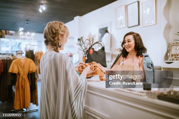 latina boutique store owner at checkout counter - store stock pictures, royalty-free photos & images