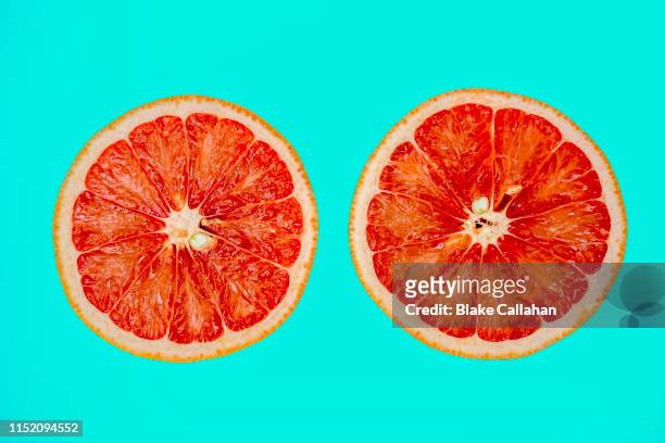 summer vibes summer theme with grapefruit halves slices - ananas aufgeschnitten stock-fotos und bilder