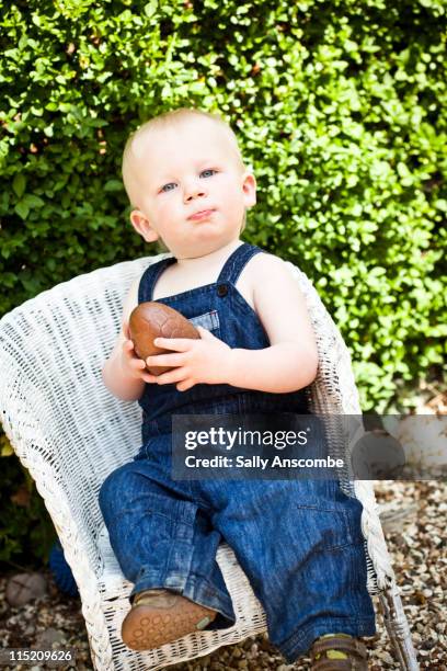 child eating chocolate easter egg - bush baby bildbanksfoton och bilder