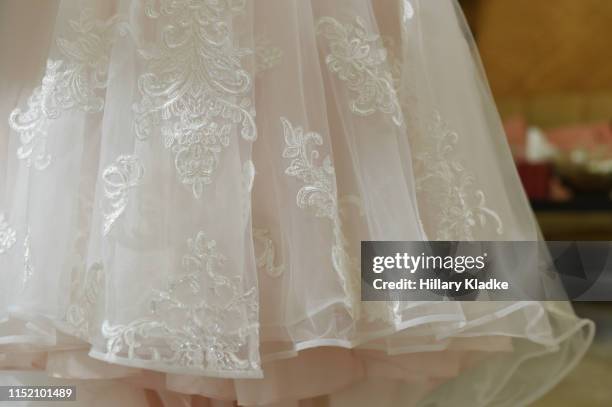close up of blush wedding dress - trouwjurk stockfoto's en -beelden