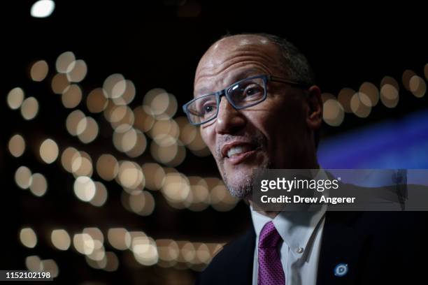 Democratic National Committee chairman Tom Perez speaks to reporters in the spin room ahead of the first Democratic presidential primary debate for...