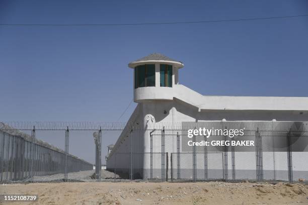 This photo taken on May 31, 2019 shows a watchtower on a high-security facility near what is believed to be a re-education camp where mostly Muslim...