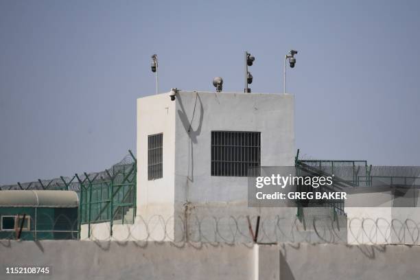 This photo taken on May 31, 2019 shows the outer wall of a complex which includes what is believed to be a re-education camp where mostly Muslim...