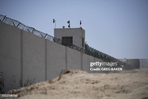 This photo taken on May 31, 2019 shows the outer wall of a complex which includes what is believed to be a re-education camp where mostly Muslim...