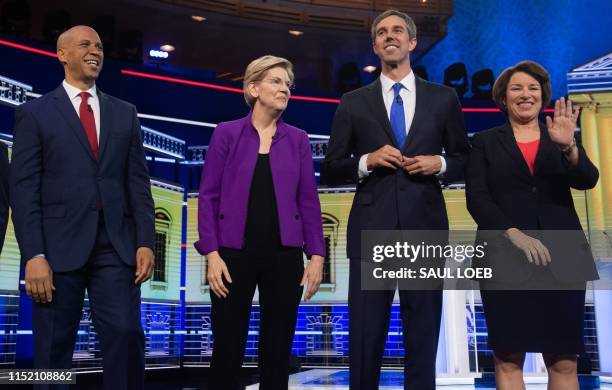 Democratic presidential hopefuls US Senator from New Jersey Cory Booker, US Senator from Massachusetts Elizabeth Warren, former US Representative for...