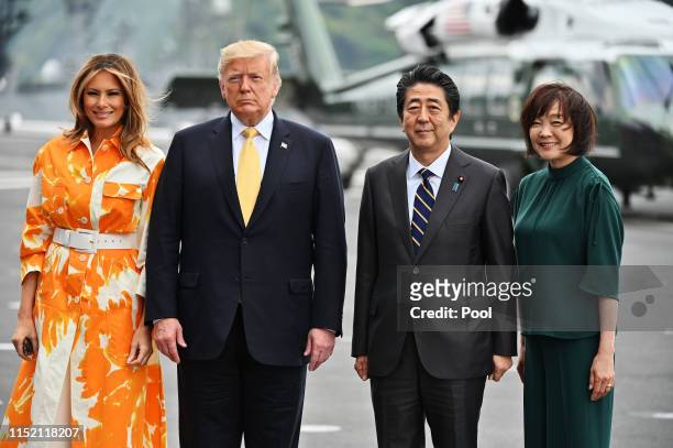 President Donald Trump and his wife Melania Trump , flanked by Shinzo Abe and Akie Abe onboard the Japan's navy ship Kaga on May 28, 2019 in...