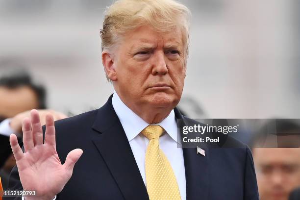 President Donald Trump and his wife Melania Trump , flanked by Shinzo Abe and Akie Abe onboard the Japan's navy ship Kaga on May 28, 2019 in...