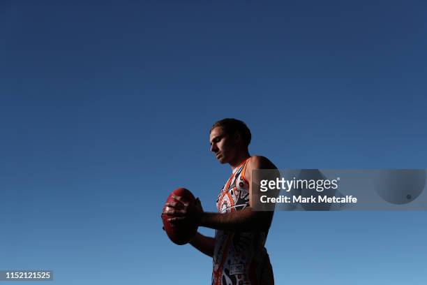 Jeremy Finlayson poses in a Giants Indigenous jumper during a Greater Western Giants AFL Media Opportunity at the Westconnex Centre on May 28, 2019...