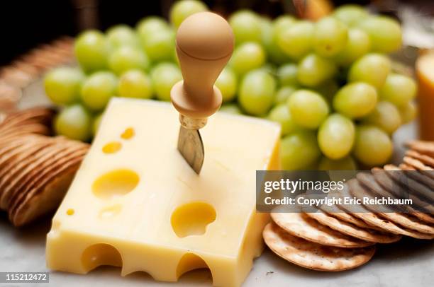 chesse, crackers and grapes - swiss cheese foto e immagini stock