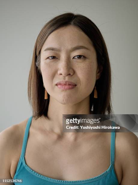 portrait of female owner teaching pilates in fitness studio - east asian ethnicity stock pictures, royalty-free photos & images