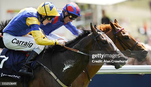 Liam Keniry riding Charles Camoin win The Investec Horses Help Heroes Stakes during The Derby Festival at Epsom racecourse on June 04, 2011 in Epsom,...