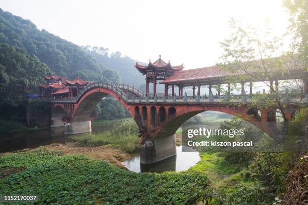 old chinese style bridge with stone arch in china . sichuan province . - chengdu stock-fotos und bilder