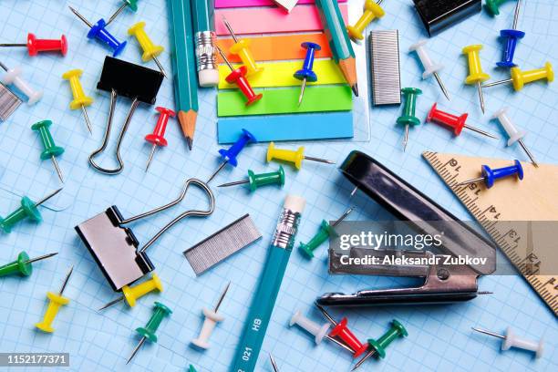 school and office stationery on a white sheet. the concept of education, office work, business, entrepreneurship. workplace freelancer. close up. - kit bildbanksfoton och bilder