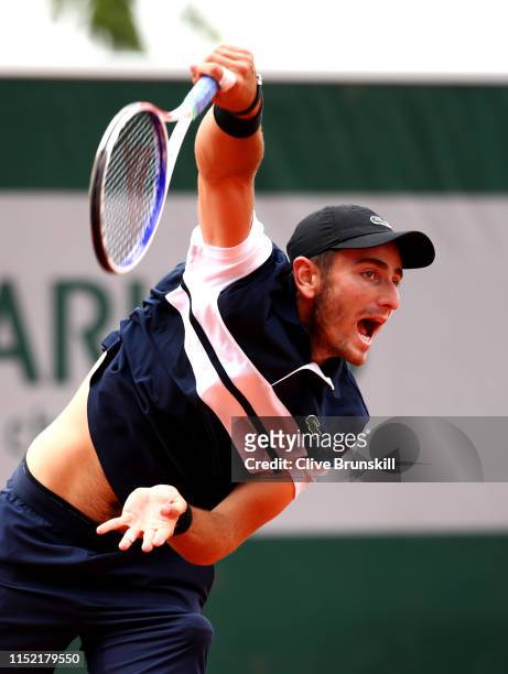 Elliot Benchetrit of France serves during his mens singles first round match against Cameron Norrie of Great Britain during Day three of the 2019...