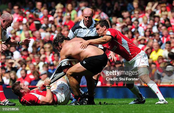 Barbarian prop Carl Hayman has his shirt ripped off him in the tackle during the International match between Wales and Barbarians at Millennium...