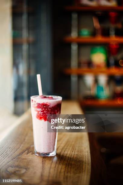 strawberry smoothie on wooden counter - lassi stock pictures, royalty-free photos & images