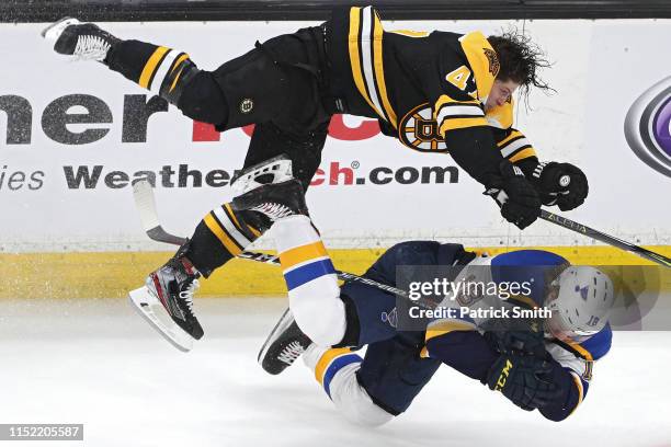Torey Krug of the Boston Bruins checks Robert Thomas of the St. Louis Blues during the third period in Game One of the 2019 NHL Stanley Cup Final at...
