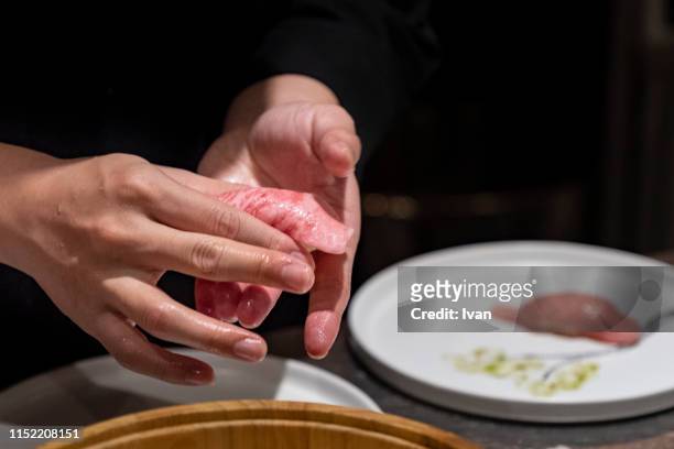 chef making wagyu sushi - sushi chef stock pictures, royalty-free photos & images