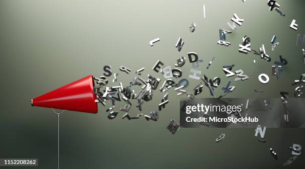 red megaphone and silver alphabet letters in front of gray wall - talking to the media stock pictures, royalty-free photos & images