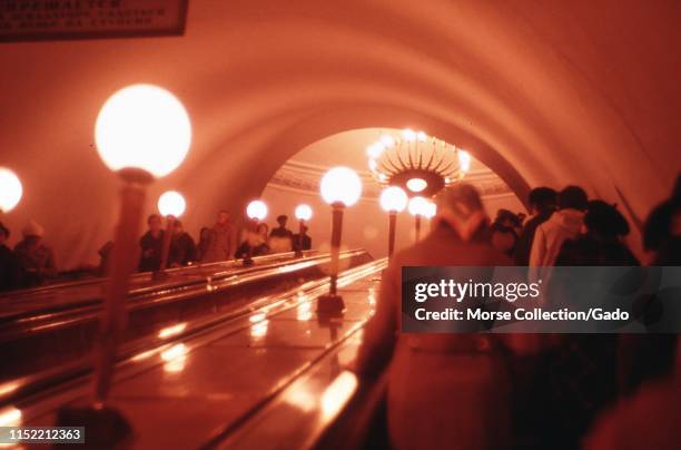 Commuters riding the escalator inside a Moscow Metro subway station, in Moscow, Russia, 1973.