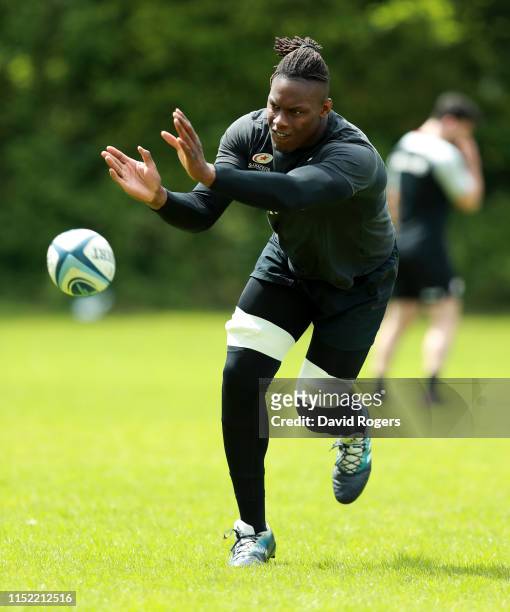 Maro Itoje passes the ball during the Saracens training session held on May 28, 2019 in St Albans, England.