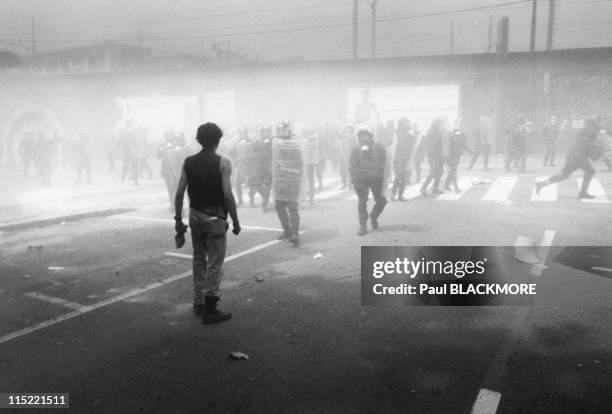 Demonstrator faces the police during protests against the 27th Group of Eight Summit in July, 2001 in Genoa, Italy. Hundreds of thousands of...