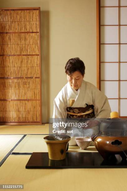 japanese tea ceremony “sado”,making some tea - tea ceremony stock pictures, royalty-free photos & images