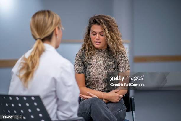 a young adult in therapy - mental illness awareness stock pictures, royalty-free photos & images