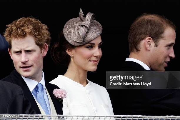 Prince Harry, Catherine, Duchess of Cambridge and Prince William, Duke of Cambridge wait for the start of the Epsom Derby at Epsom Downs racecourse...