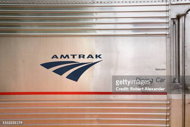 The Amtrak logo on the side of the dining car of an Amtrak train stopped at the railroad depot in Lamy, New Mexico, near Santa Fe. Amtrak's Southwest...
