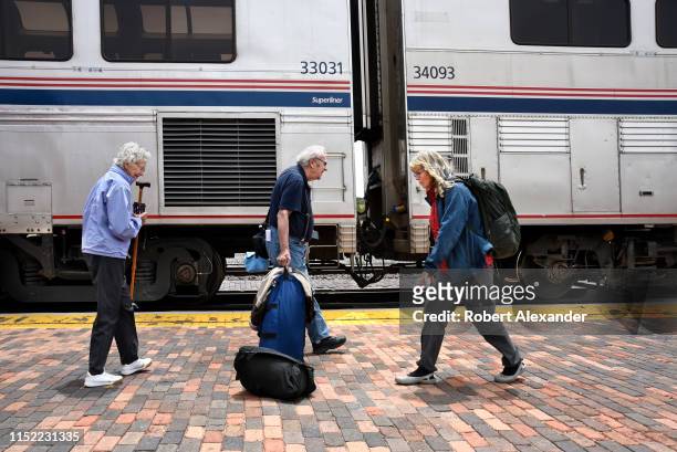 Passengers board an Amtrak train at the railroad depot in Lamy, New Mexico, near Santa Fe. Amtrak's Southwest Chief, which transports passengers...