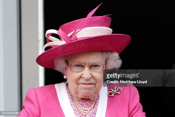 Queen Elizabeth II reacts after her horse Carlton House comes in third in the Epsom Derby at Epsom Downs racecourse on June 4, 2011 in Epsom,...