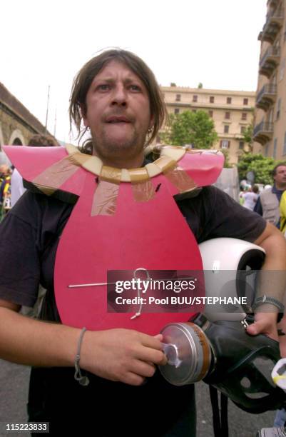 Member of Tutte Bianche watches during protests against the 27th Group of Eight Summit on July 20, 2001 in Genoa, Italy. Hundreds of thousands of...
