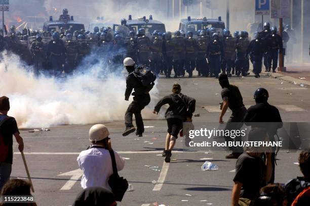 Demonstrators clash with police during protests against the 27th Group of Eight Summit on July 21, 2001 in Genoa, Italy. Hundreds of thousands of...